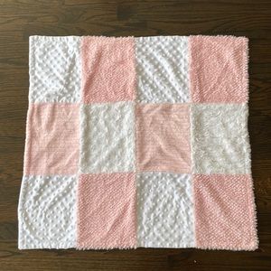 Pink and white baby blanket